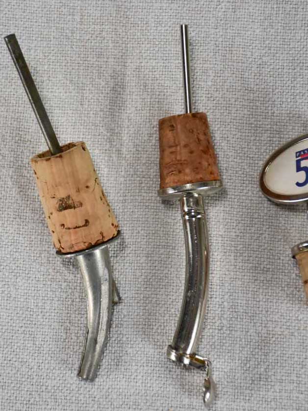 Three spirit pourers from the early twentieth century