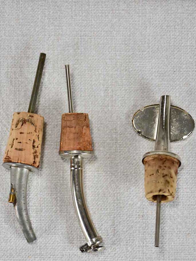 Three spirit pourers from the early twentieth century