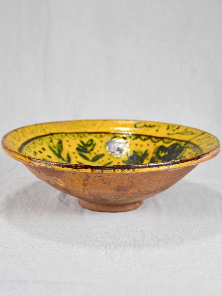 Antique folk art terracotta bowl with yellow glaze 11½"