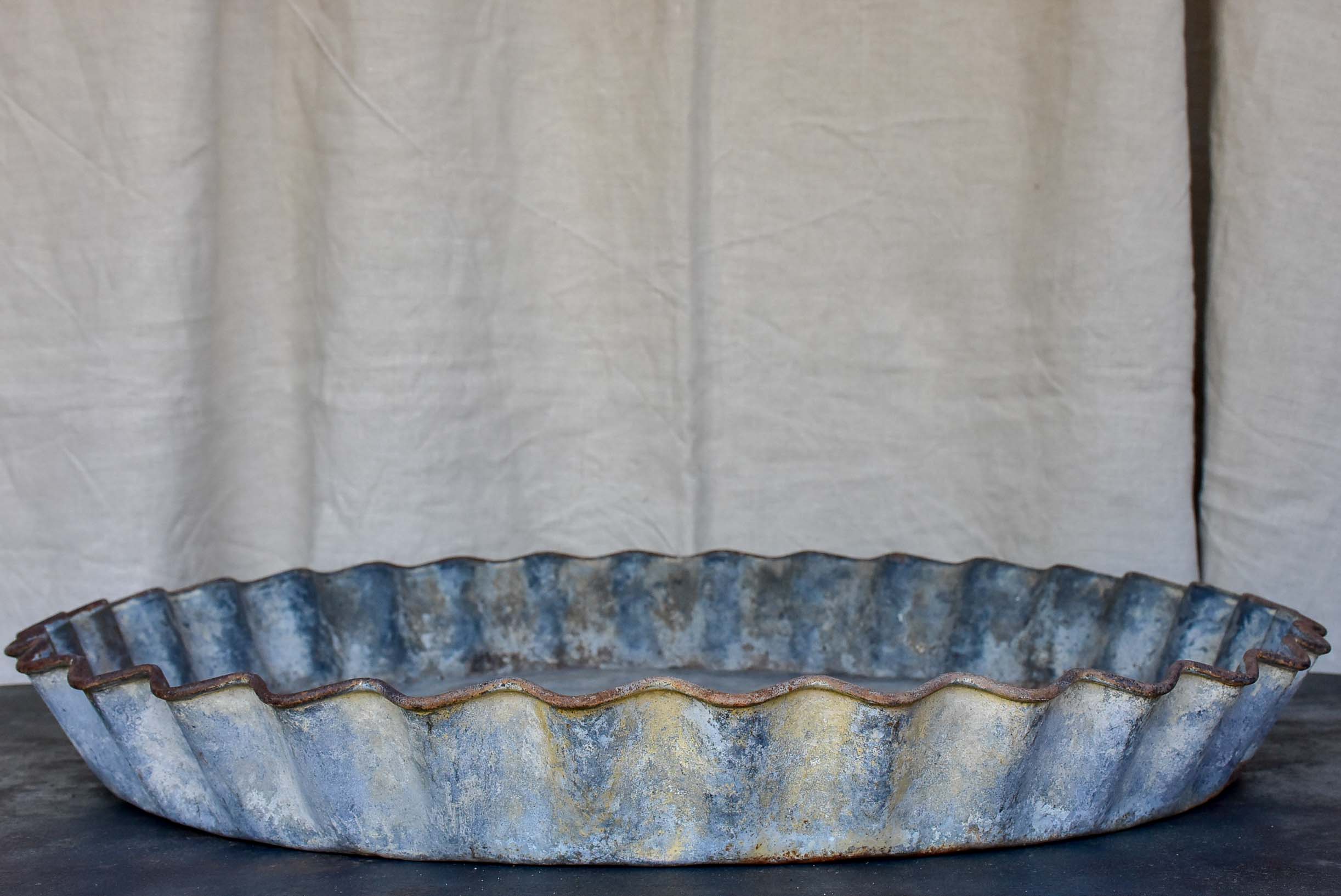 Five large antique French zinc dishes with rippled edge for harvesting resin