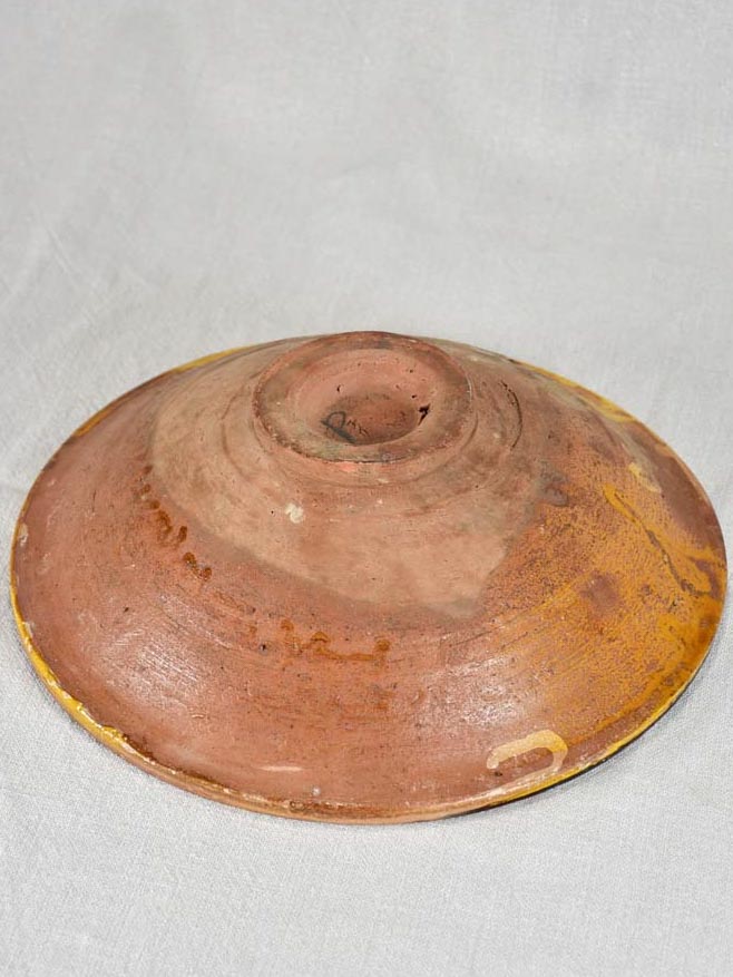 Antique folk art terracotta bowl with yellow glaze 11½"