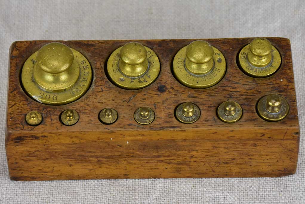 Set of eleven antique French weights for scales - 1-200g