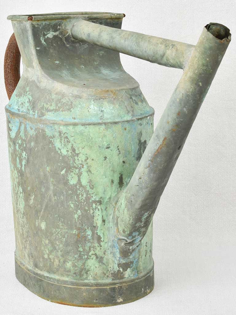 Antique French watering can with verdigris patina