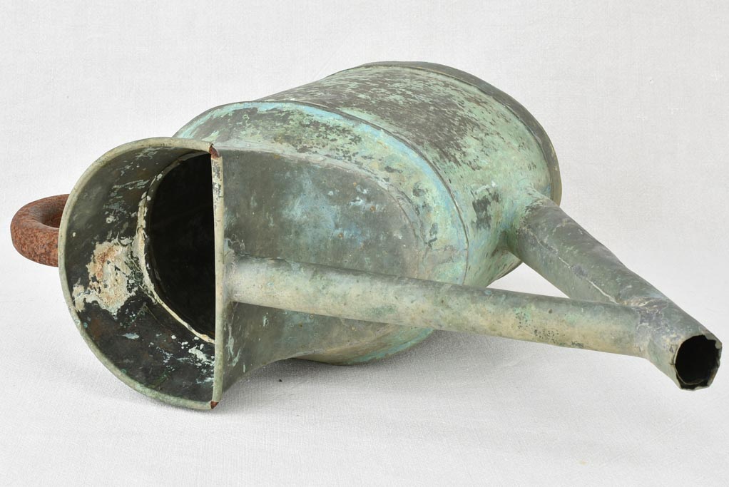 Antique French watering can with verdigris patina