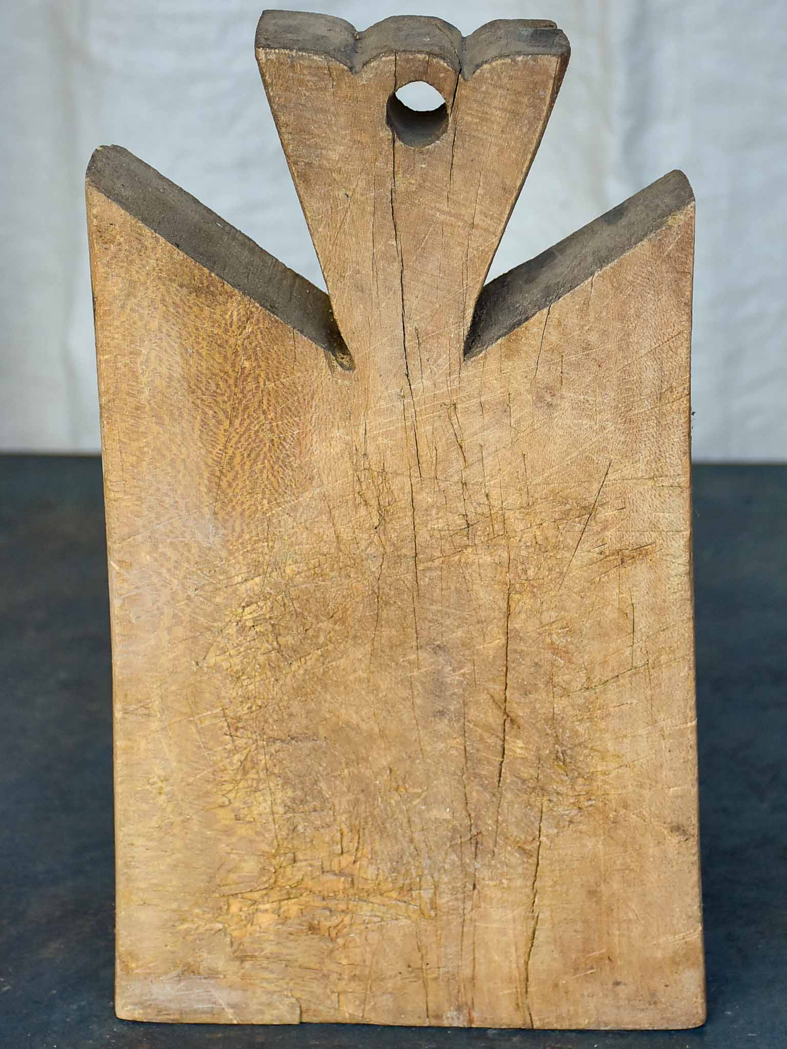 Small antique French cutting board with pretty handle 13”
