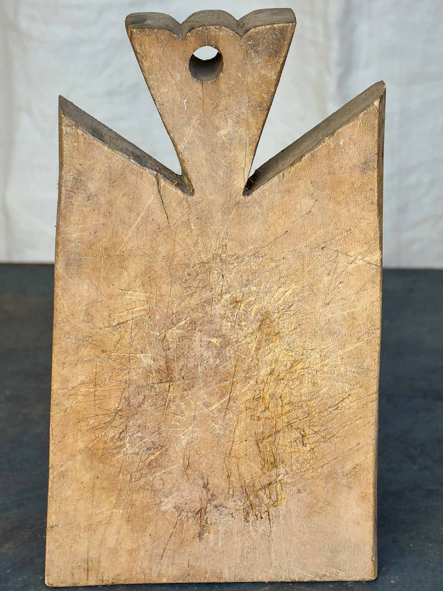 Small antique French cutting board with pretty handle 13”