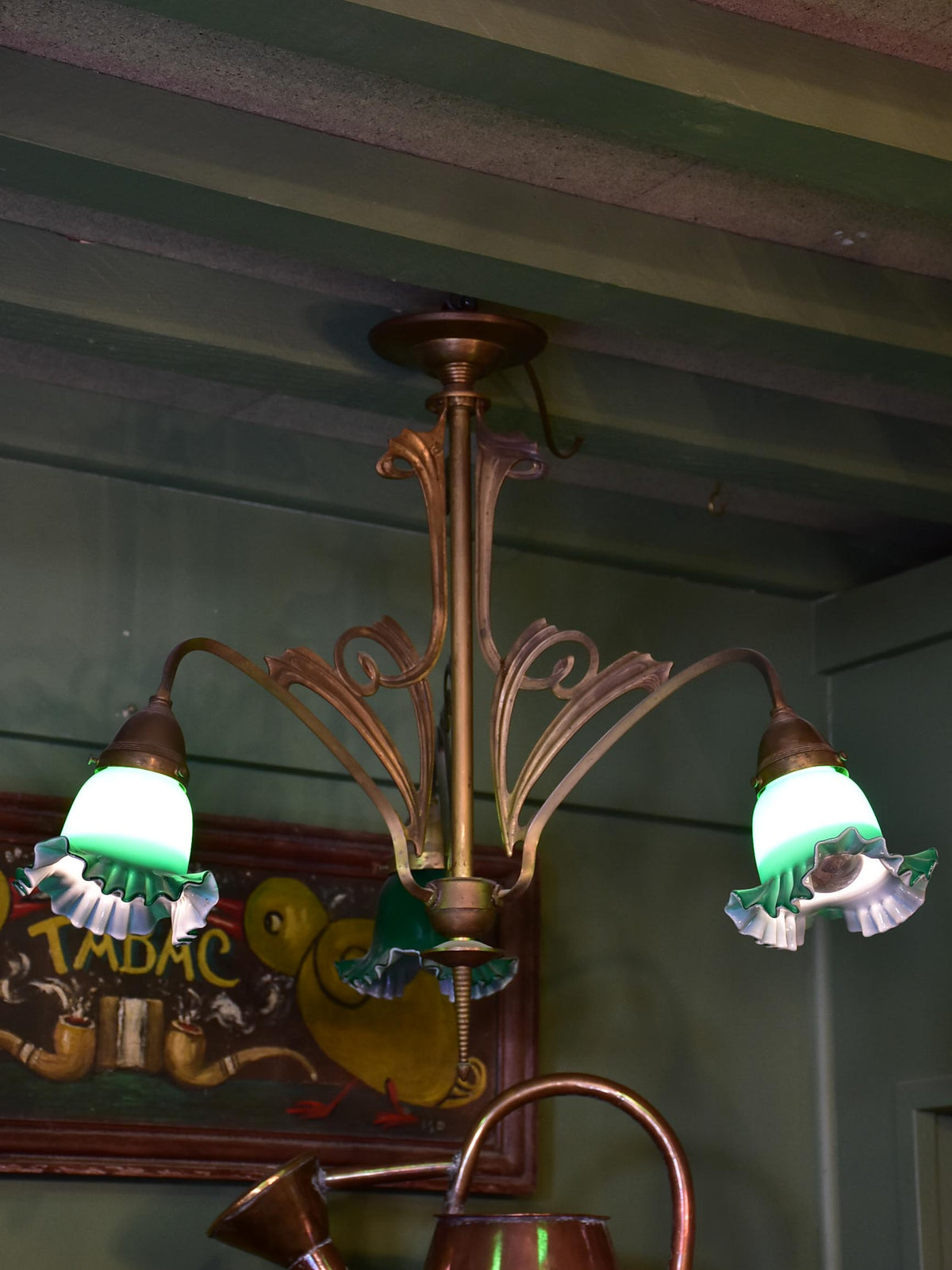 French Art Nouveau three light pendant with green glass lampshades