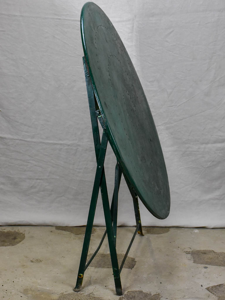 Round antique French folding garden table with green paint finish