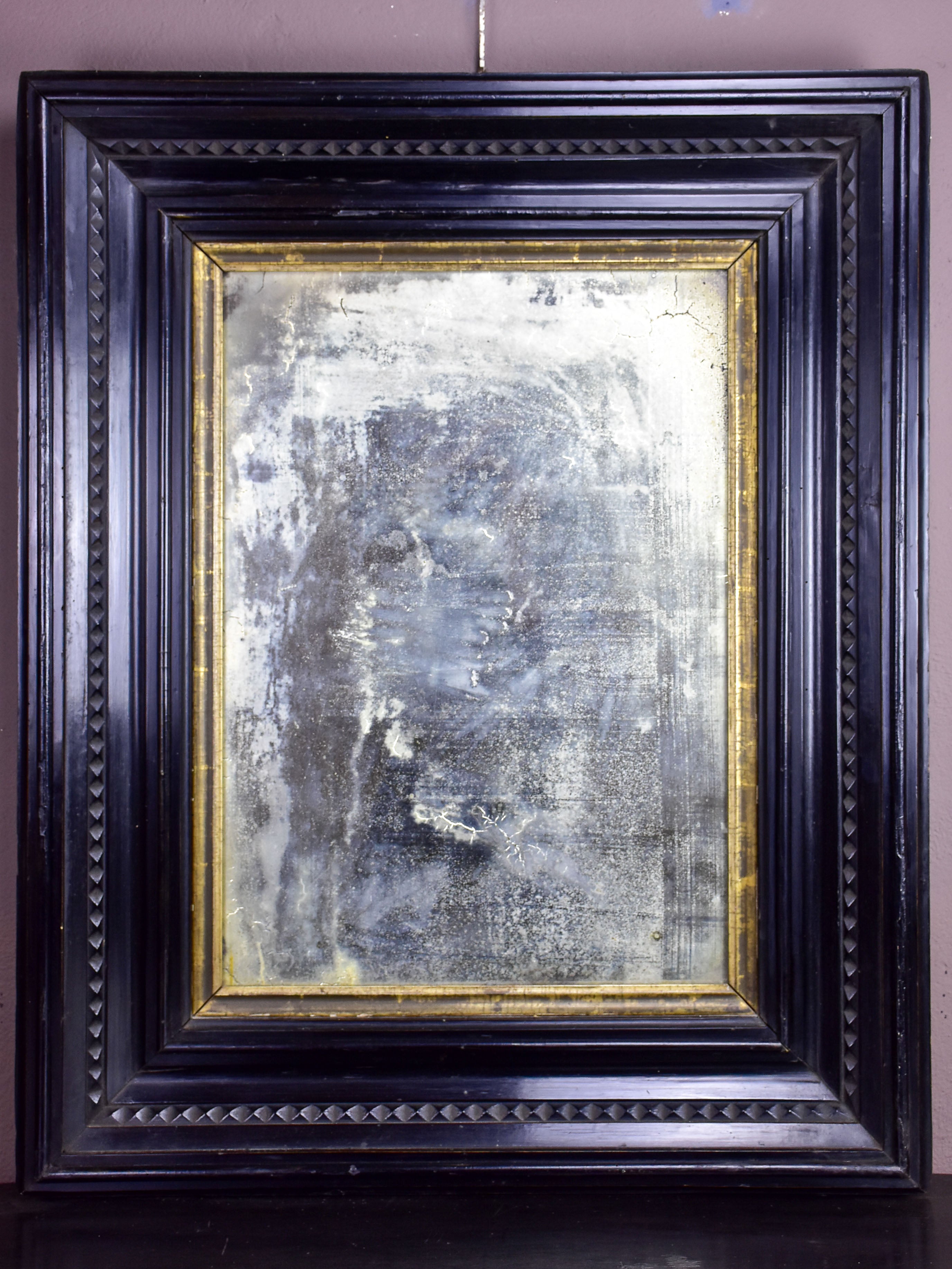 19th century Italian mirror with wide carved frame