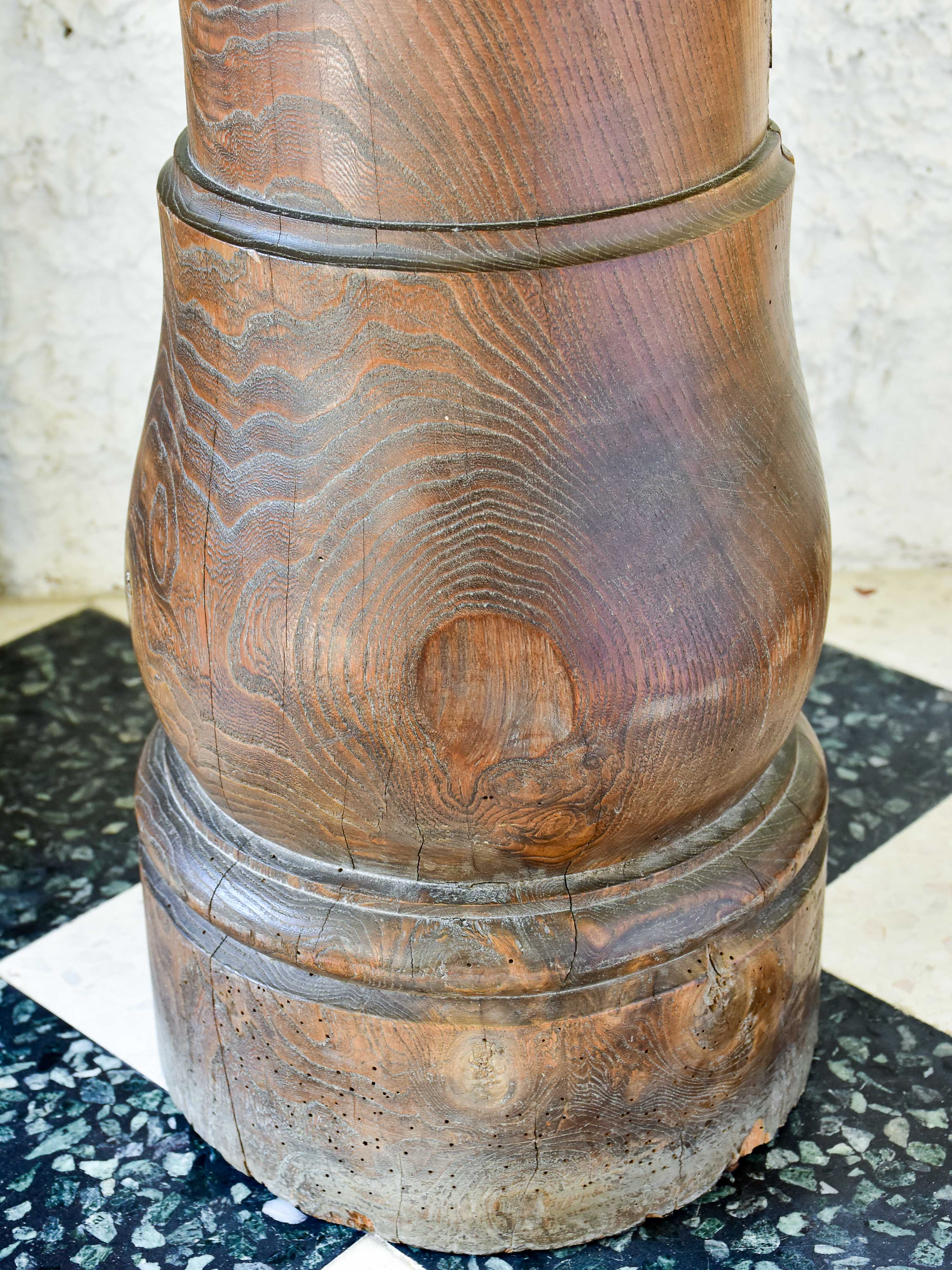 Marble mortar with double headed pestle in carved timber stand
