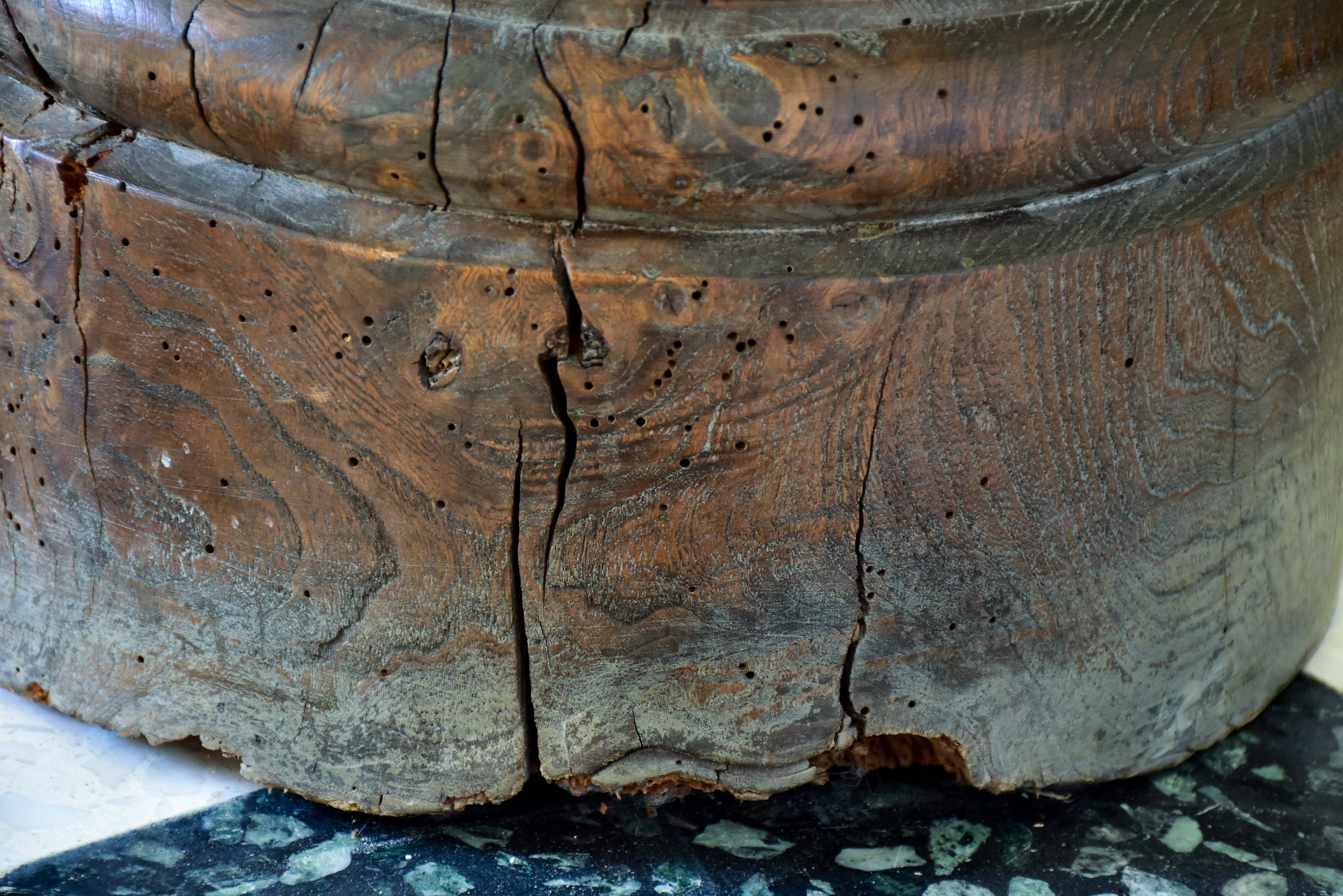 Marble mortar with double headed pestle in carved timber stand