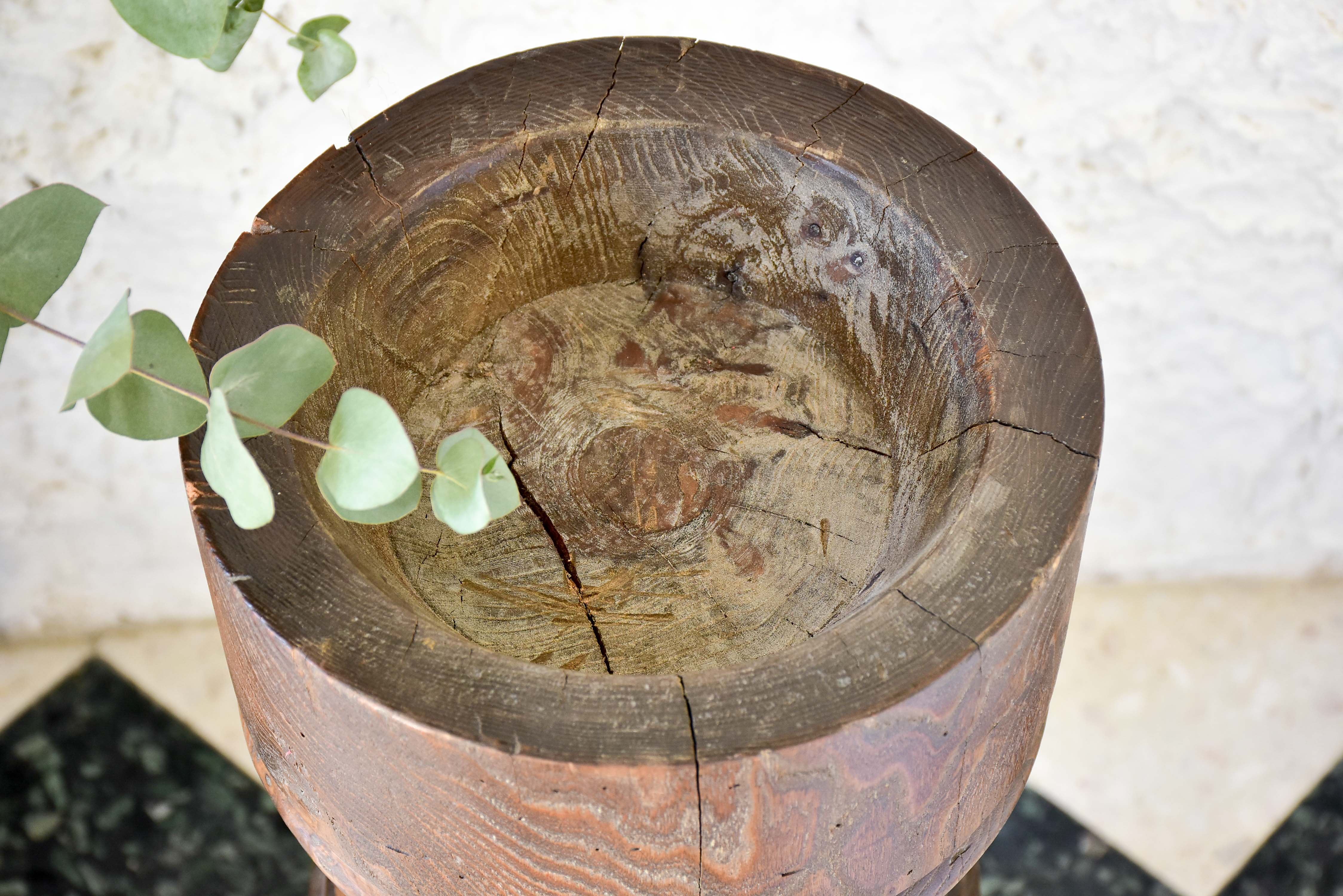 Marble mortar with double headed pestle in carved timber stand