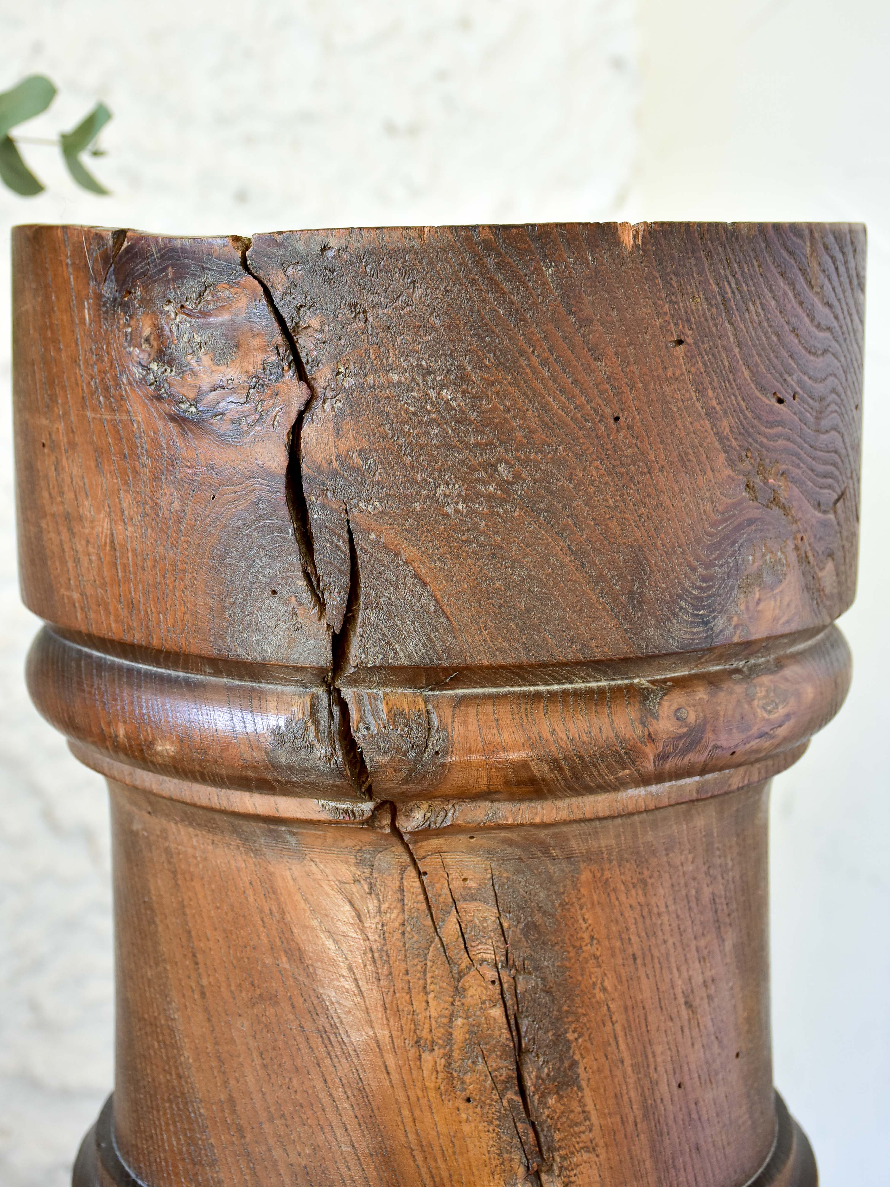 Marble mortar with double headed pestle in carved timber stand