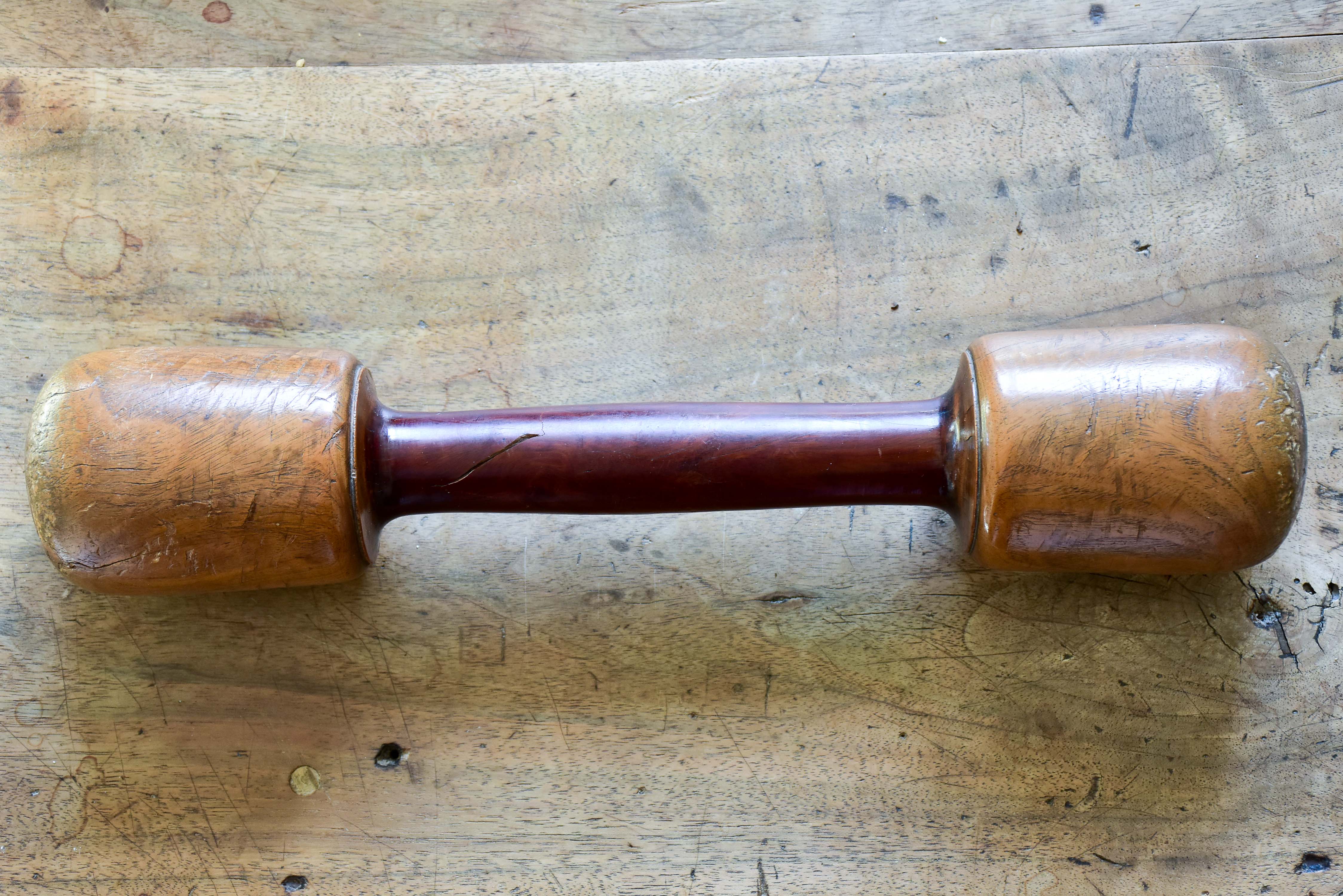 Marble mortar with double headed pestle in carved timber stand