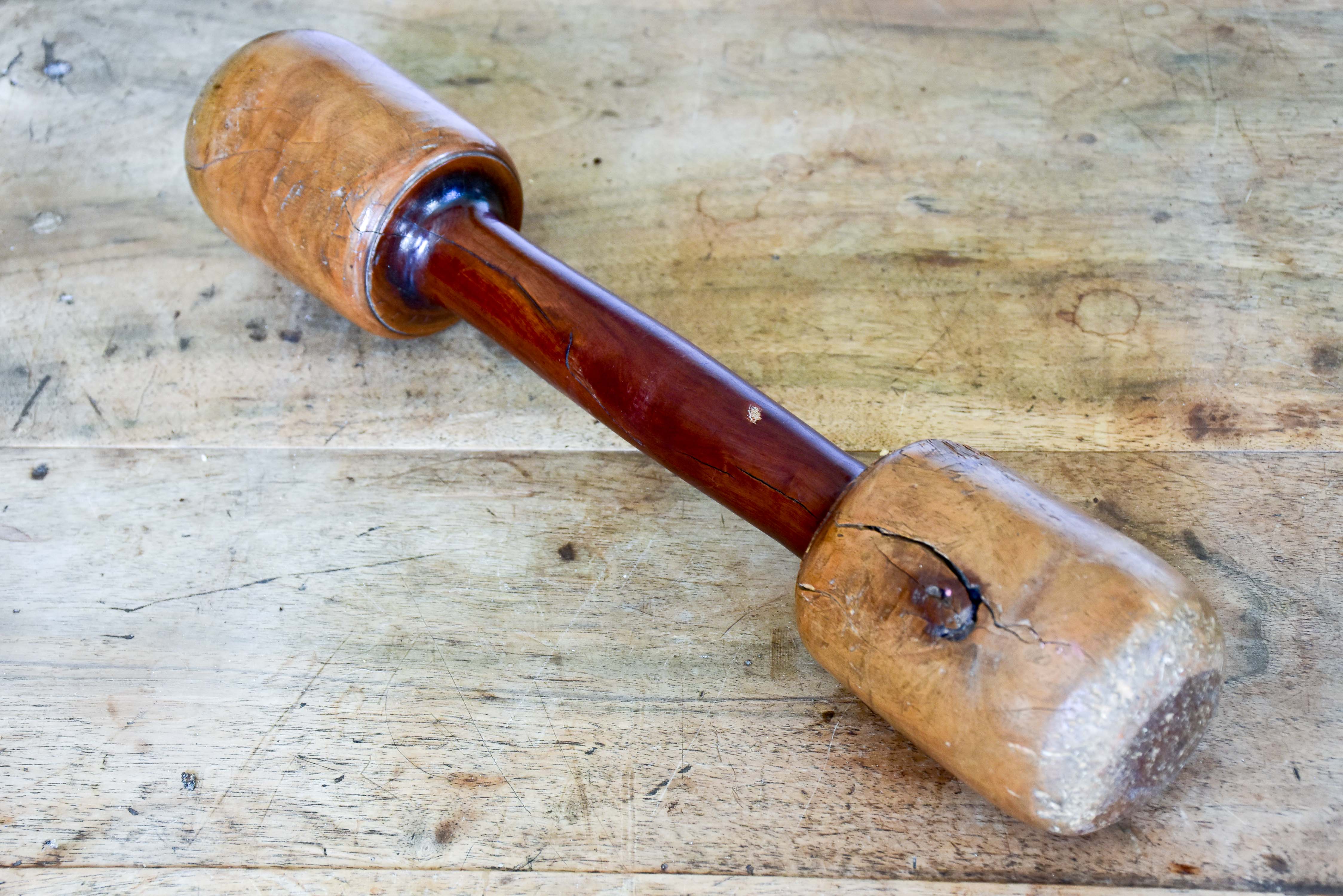 Marble mortar with double headed pestle in carved timber stand