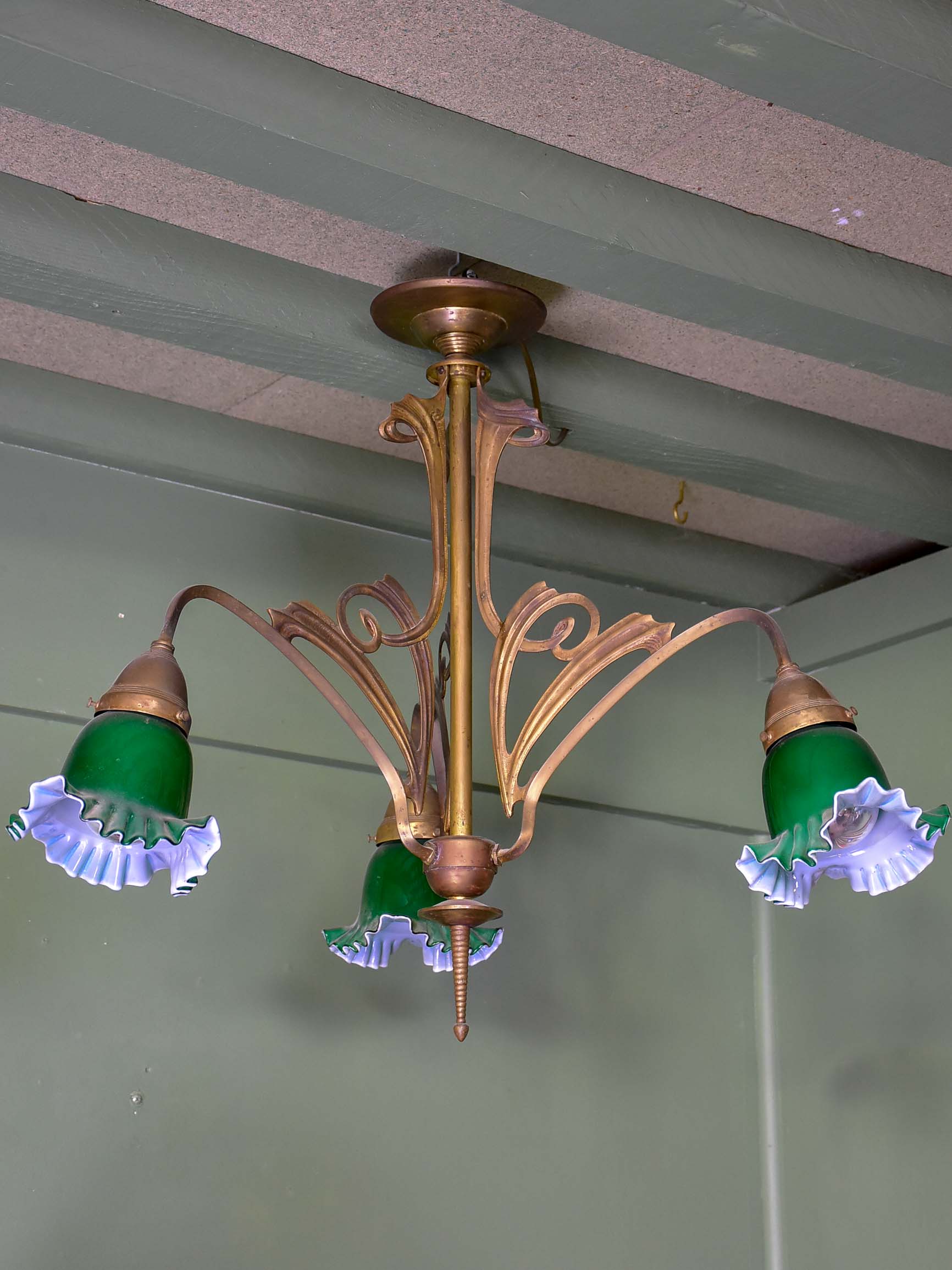 French Art Nouveau three light pendant with green glass lampshades