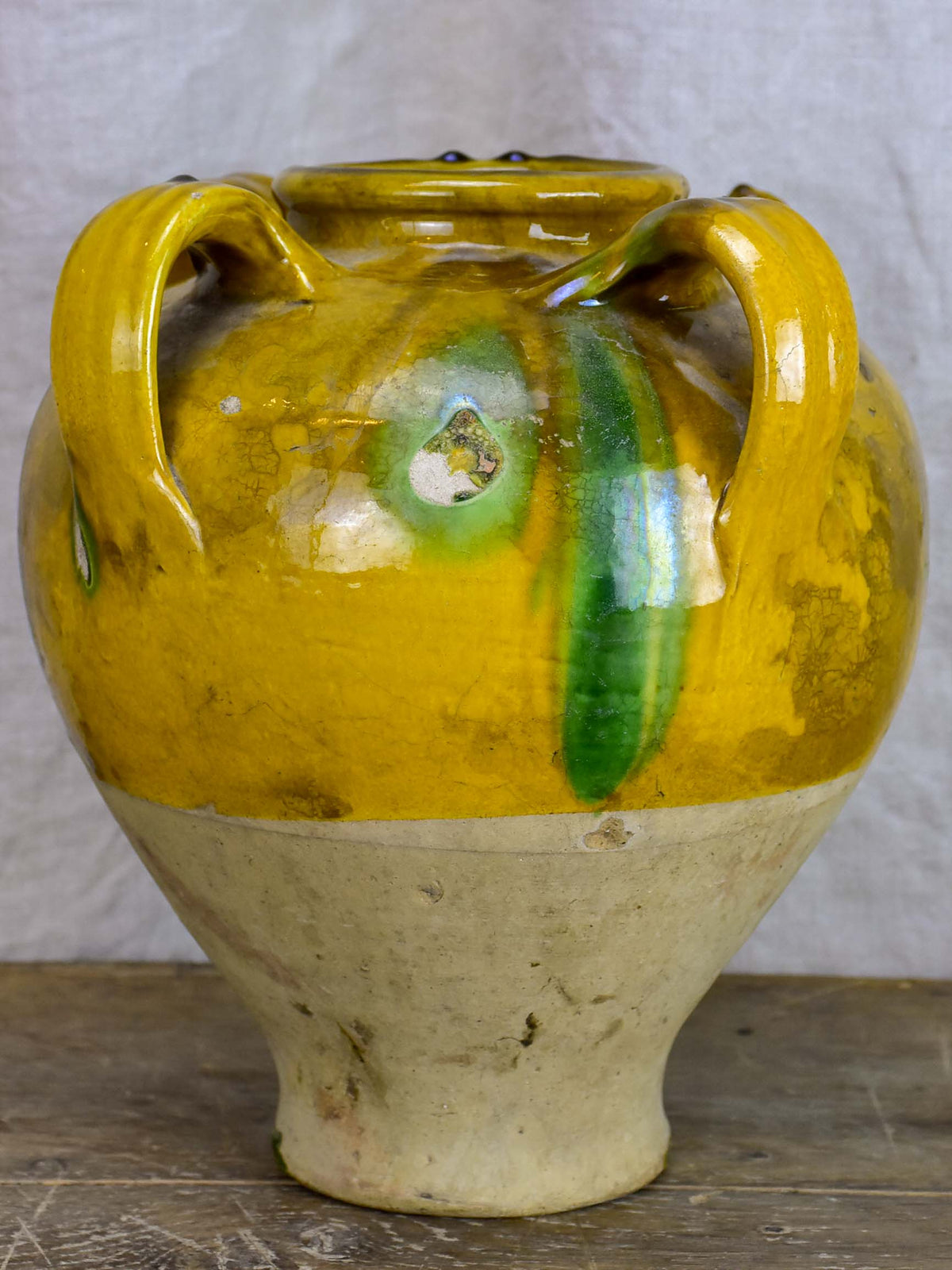 Antique French water jug with yellow and green glaze