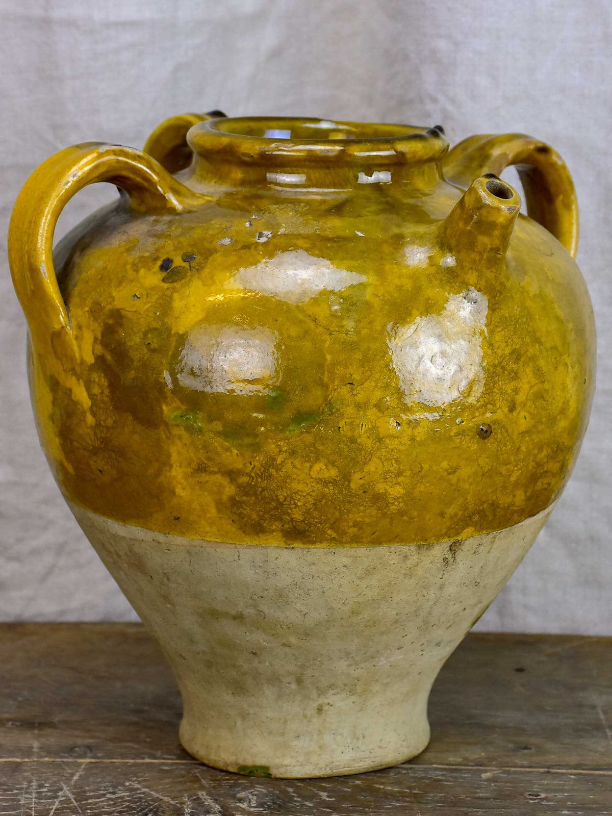 Antique French water jug with yellow and green glaze