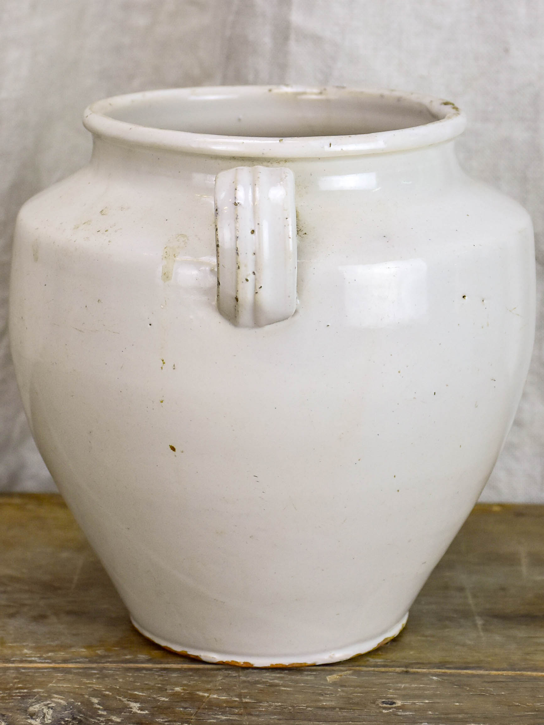 Antique earthenware preserving pot with white glaze