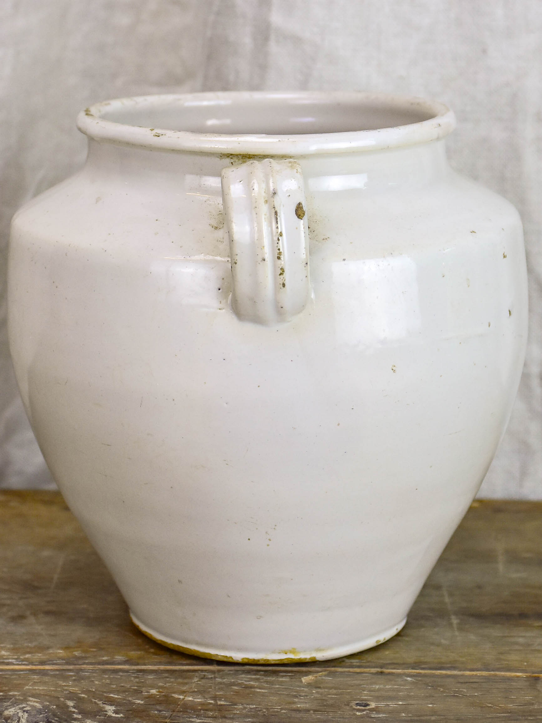 Antique earthenware preserving pot with white glaze