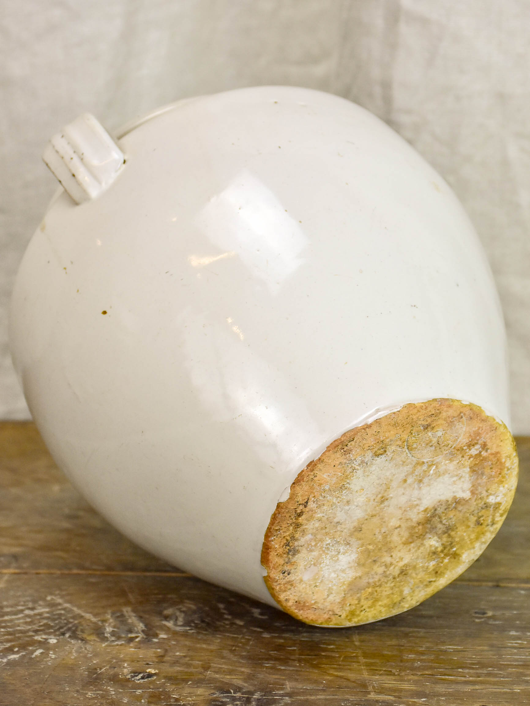 Antique earthenware preserving pot with white glaze