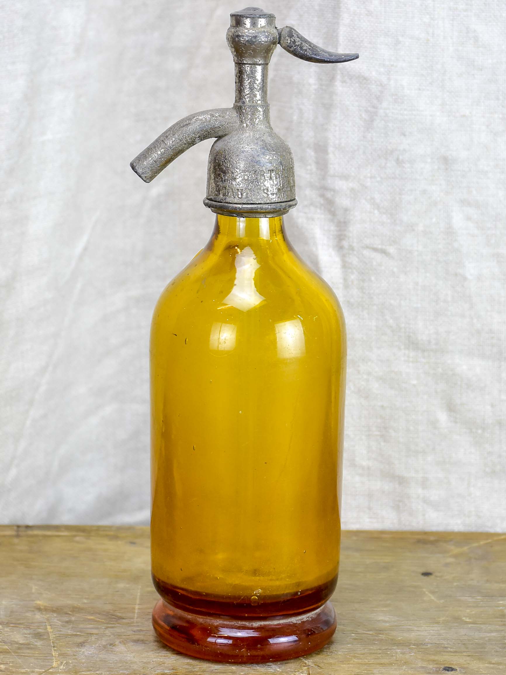 Antique French half-size Seltzer bottle - yellow / amber