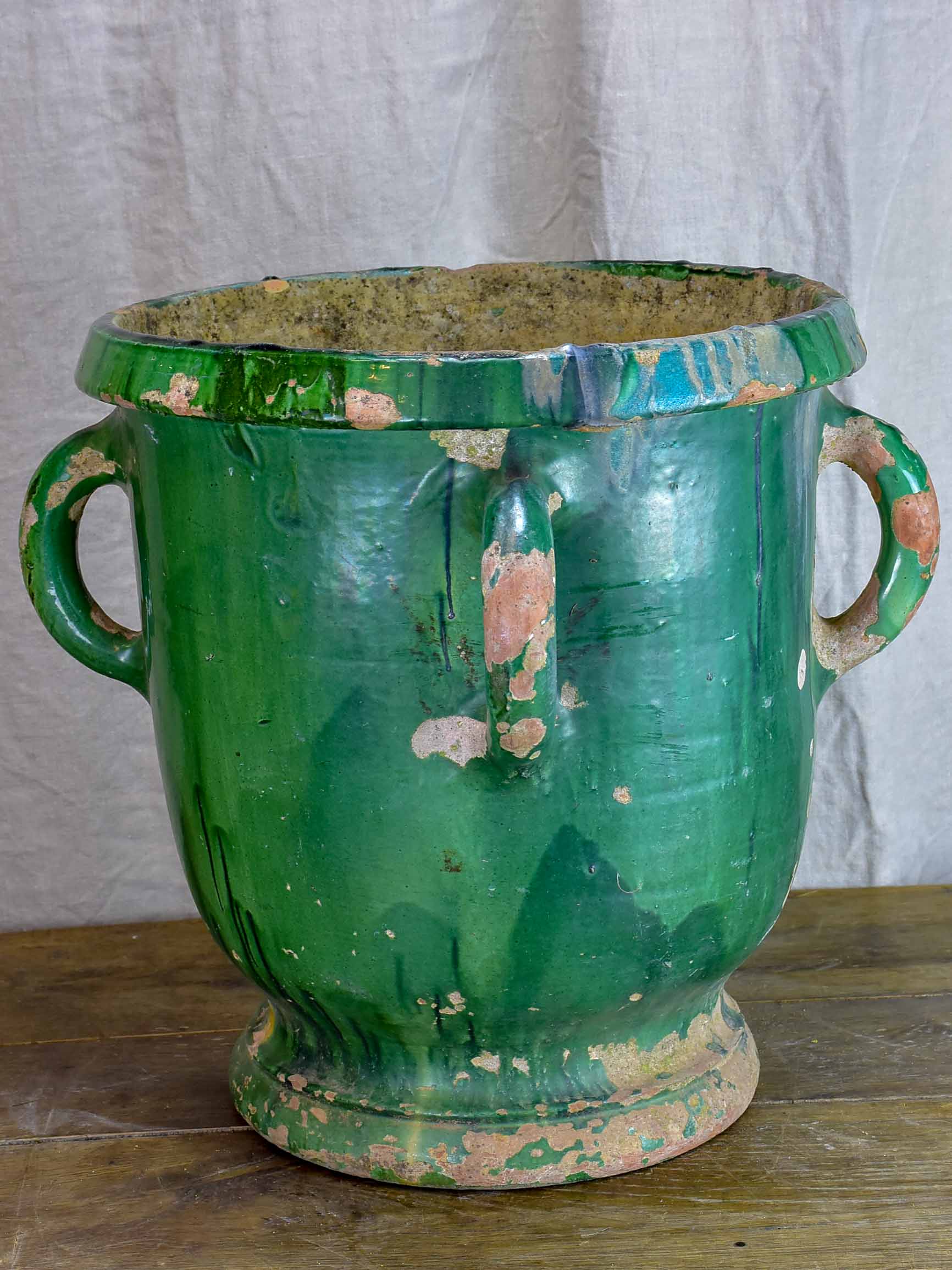 Very large antique French garden planter with green glaze and 4 handles