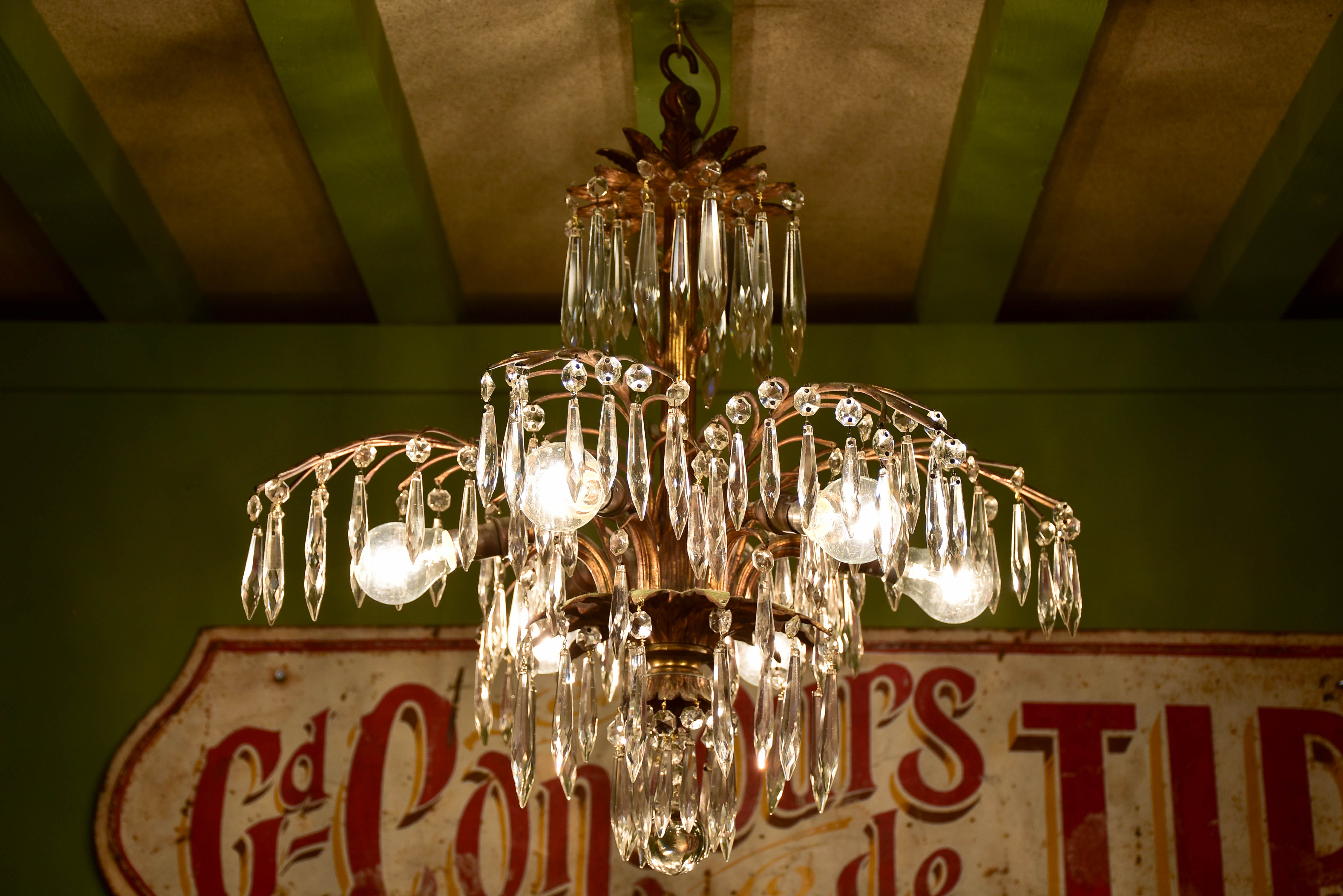 Gold palm frond chandelier with crystals