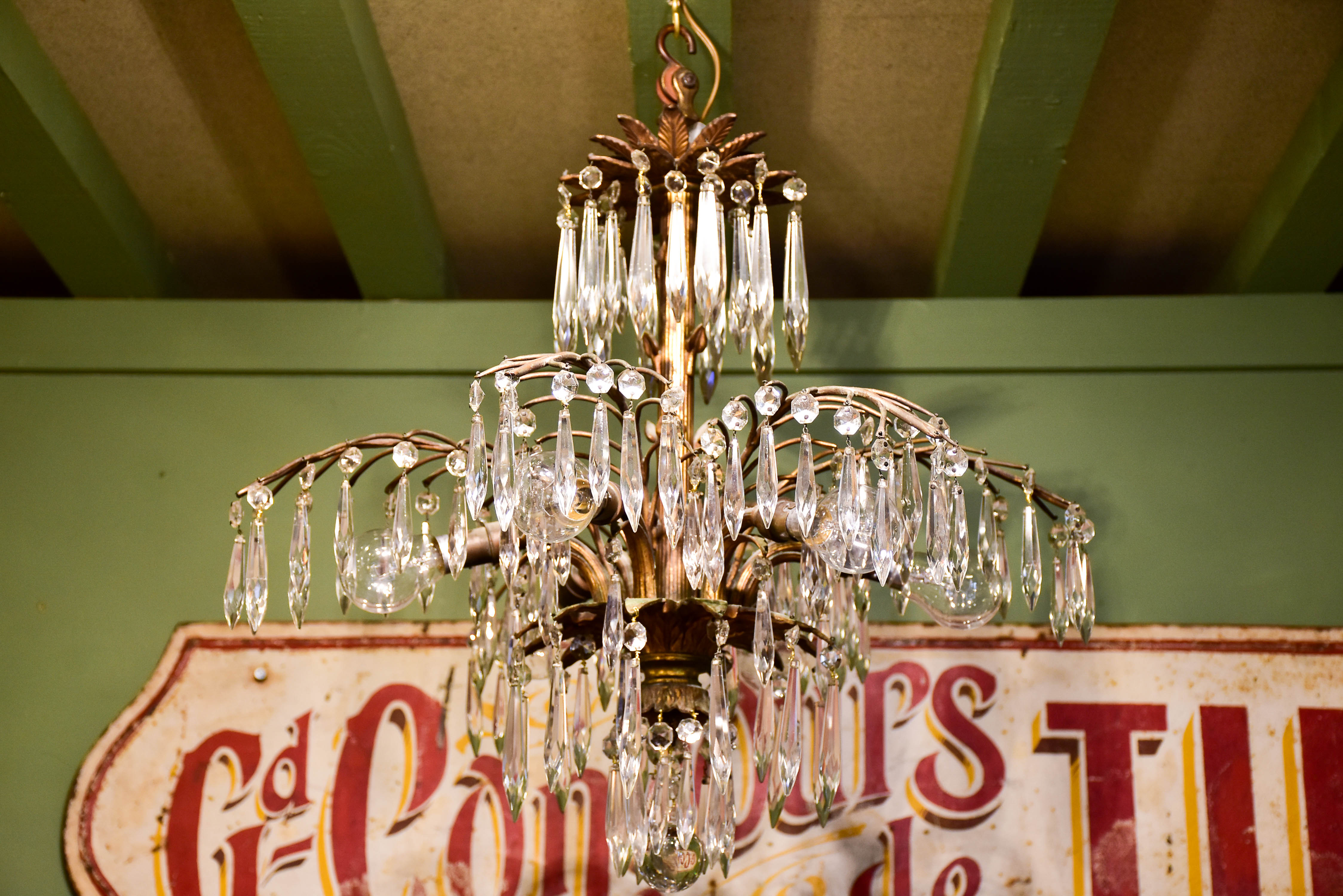 Gold palm frond chandelier with crystals