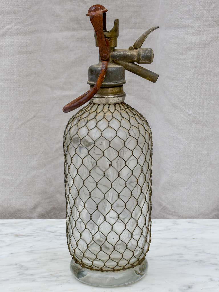 Early 20th Century French seltzer bottle with mesh