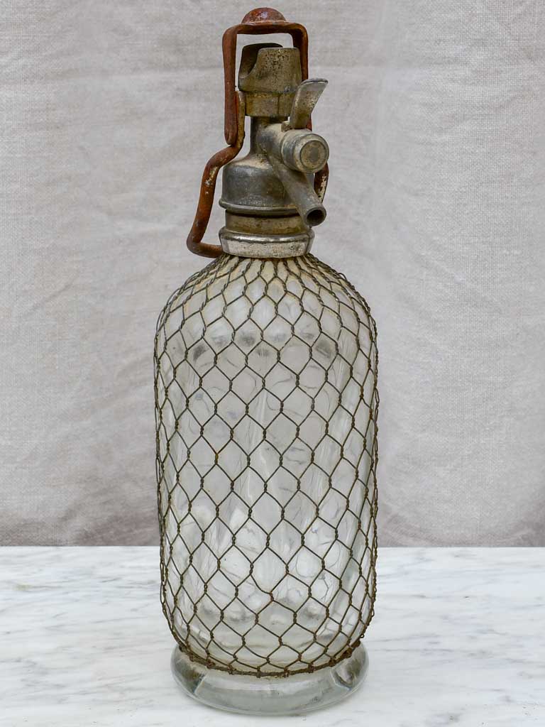 Early 20th Century French seltzer bottle with mesh