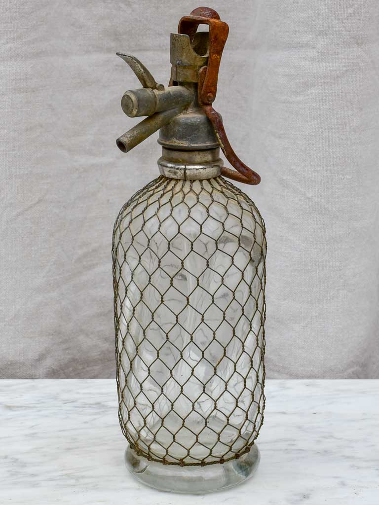 Early 20th Century French seltzer bottle with mesh