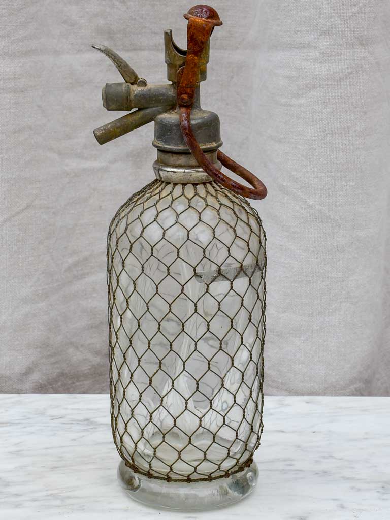 Early 20th Century French seltzer bottle with mesh