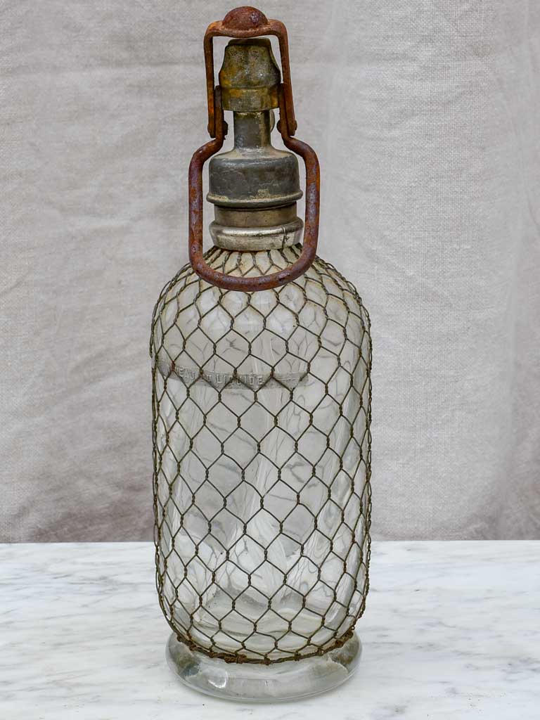 Early 20th Century French seltzer bottle with mesh