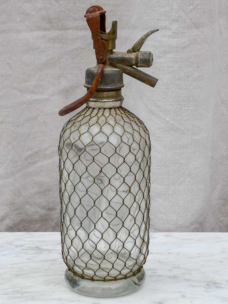 Early 20th Century French seltzer bottle with mesh