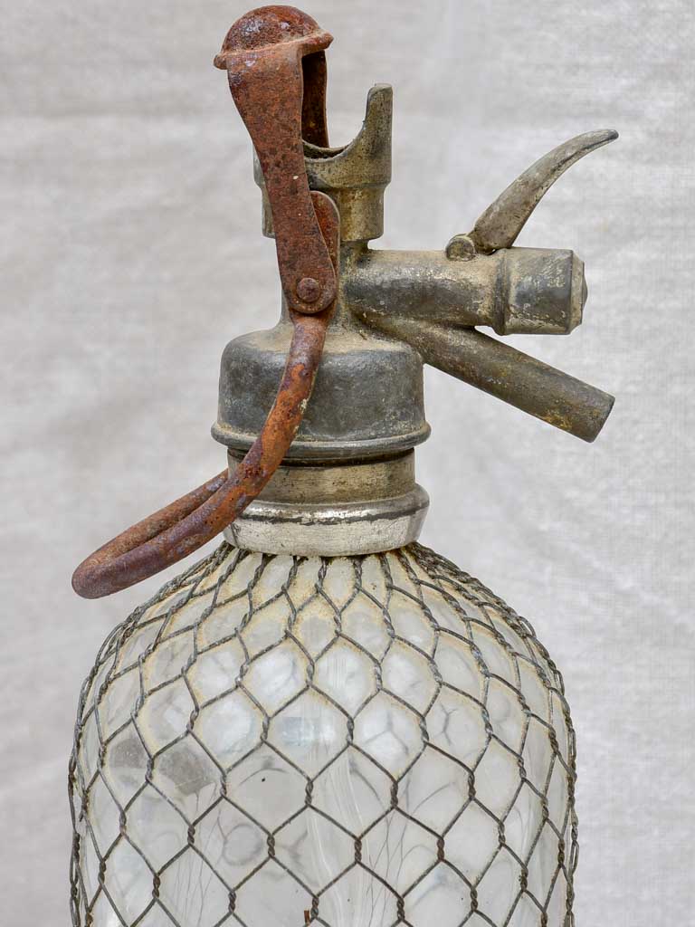 Early 20th Century French seltzer bottle with mesh