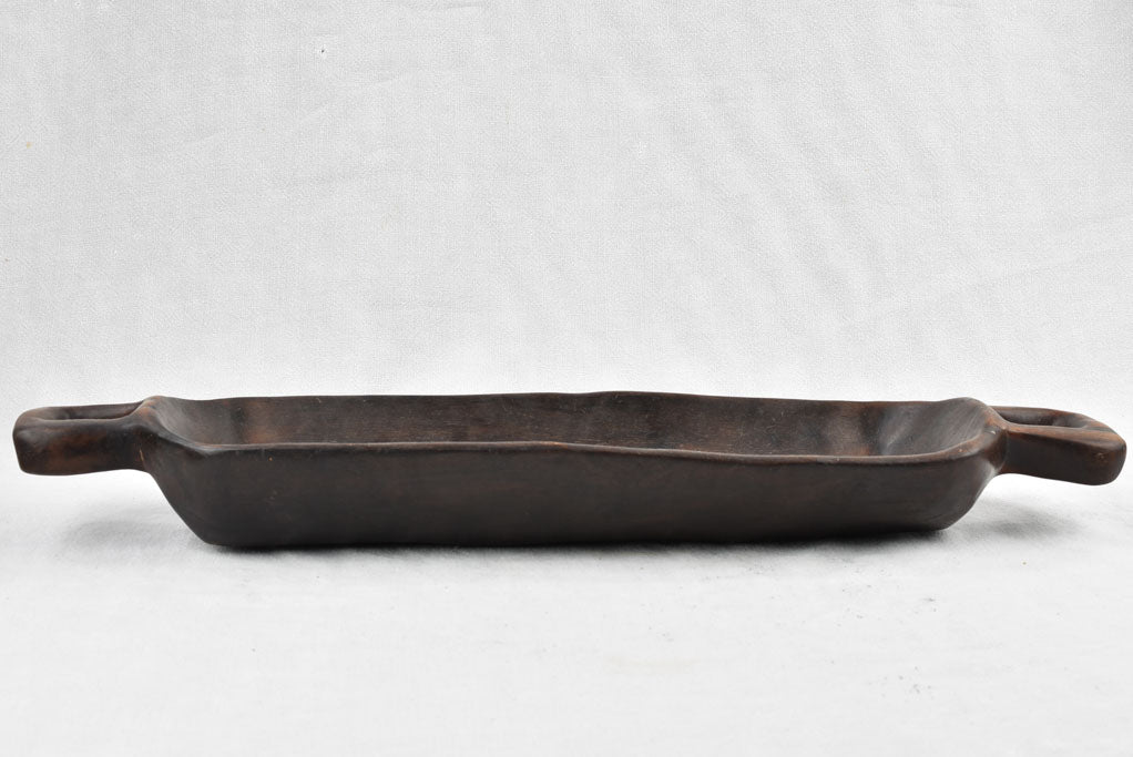 Vintage wooden long bowl with patina