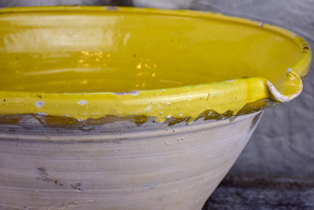Large antique French 'tian' bowl with yellow glaze