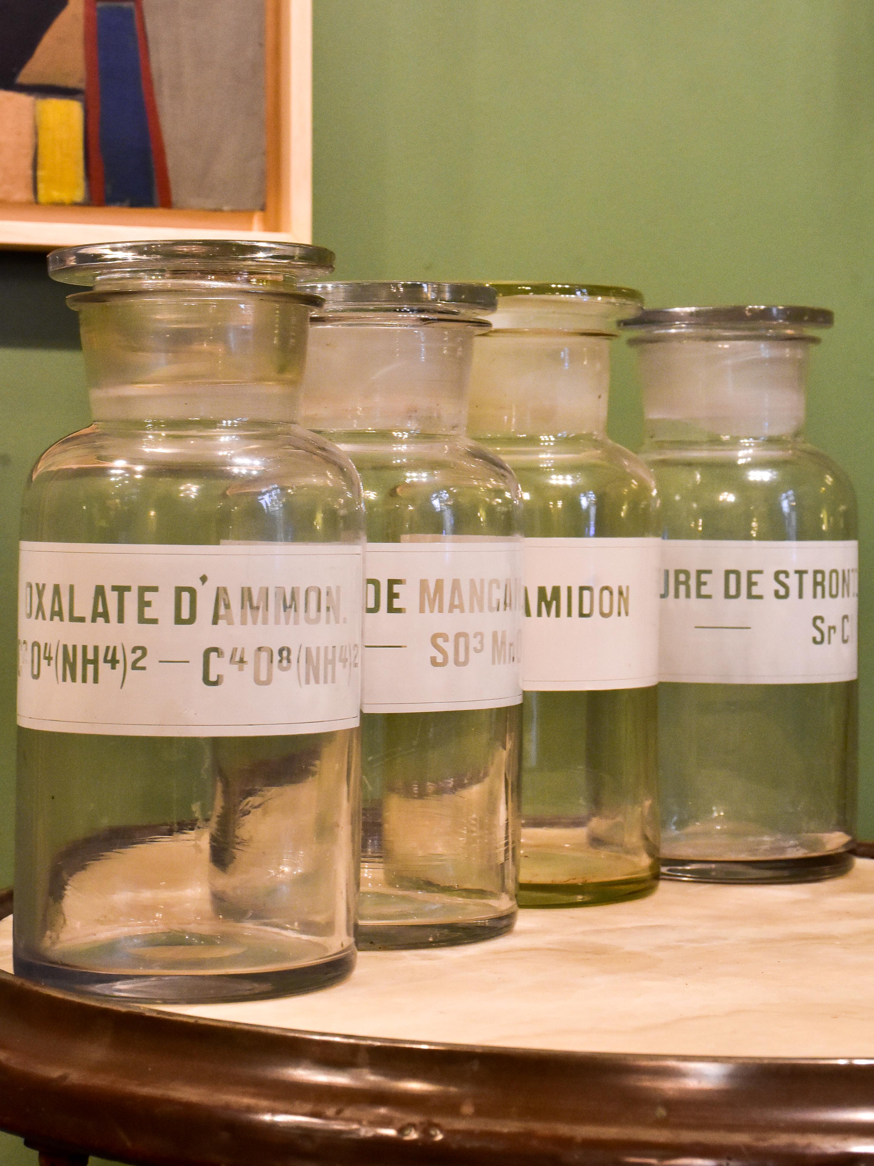 Four antique French apothecary glass jars