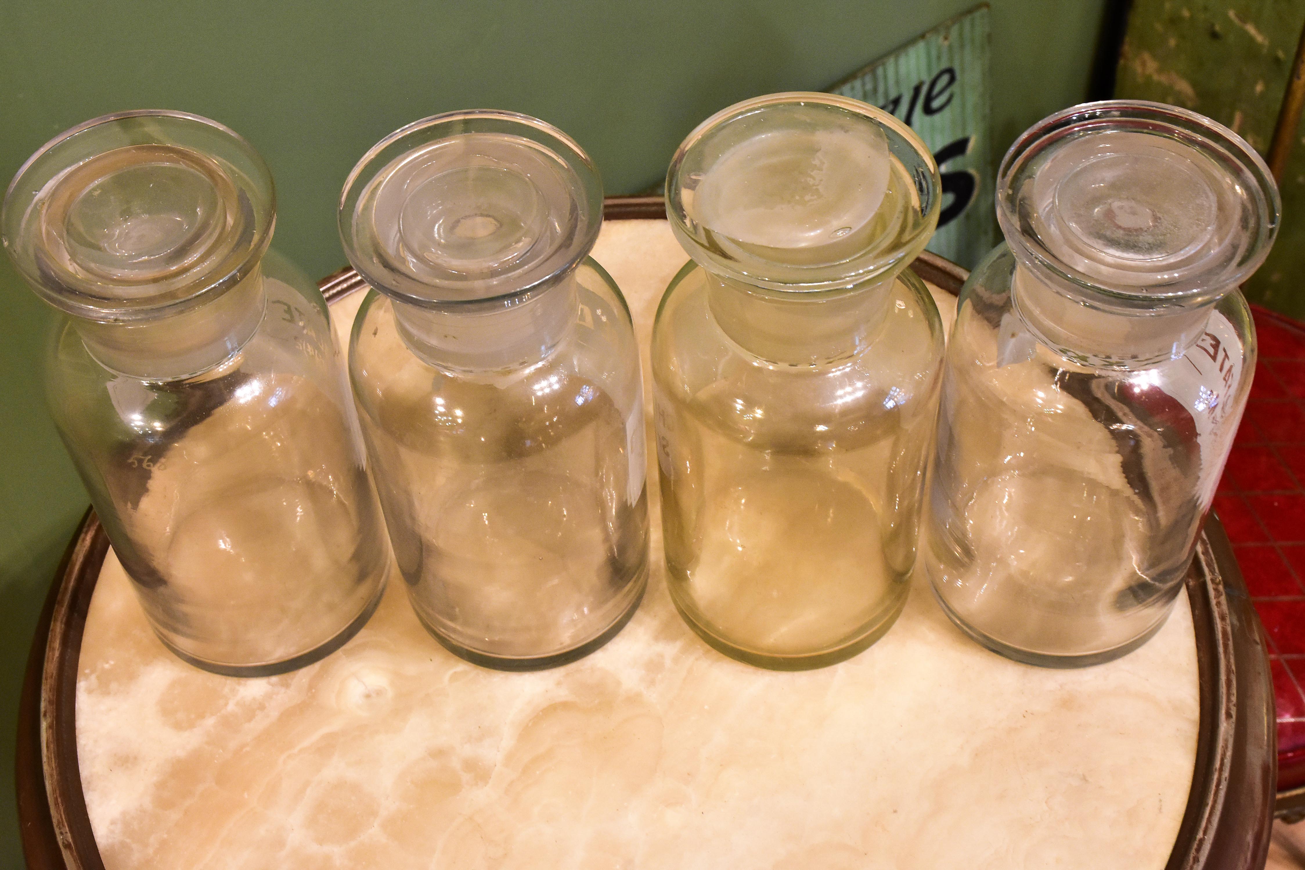 Four antique French apothecary glass jars