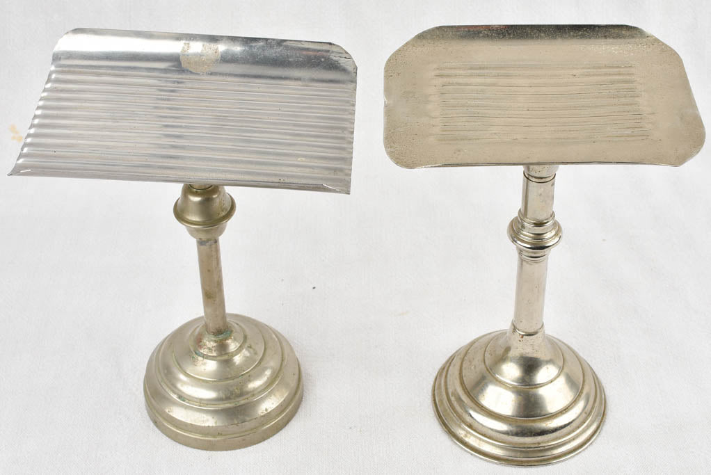 Two antique footed coin trays from a counter