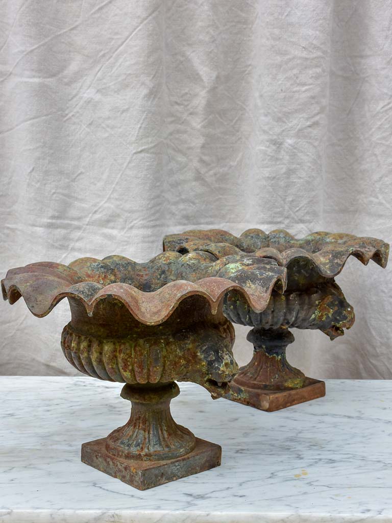 Pair of 19th Century cast iron Medici urns with lion's heads