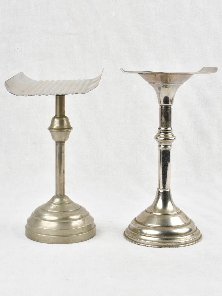 Two antique footed coin trays from a counter