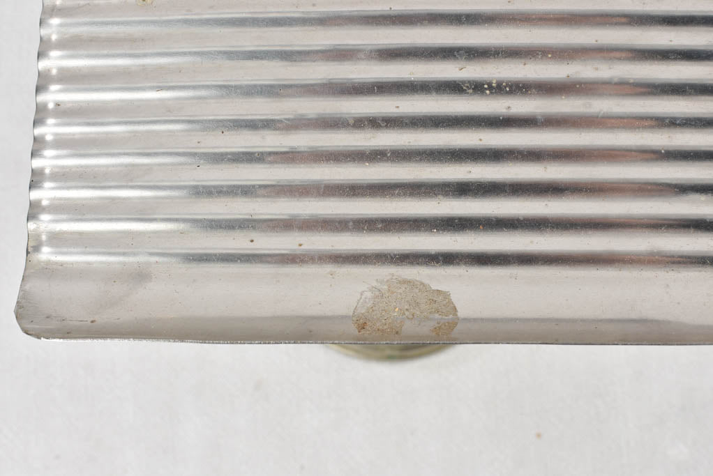 Two antique footed coin trays from a counter