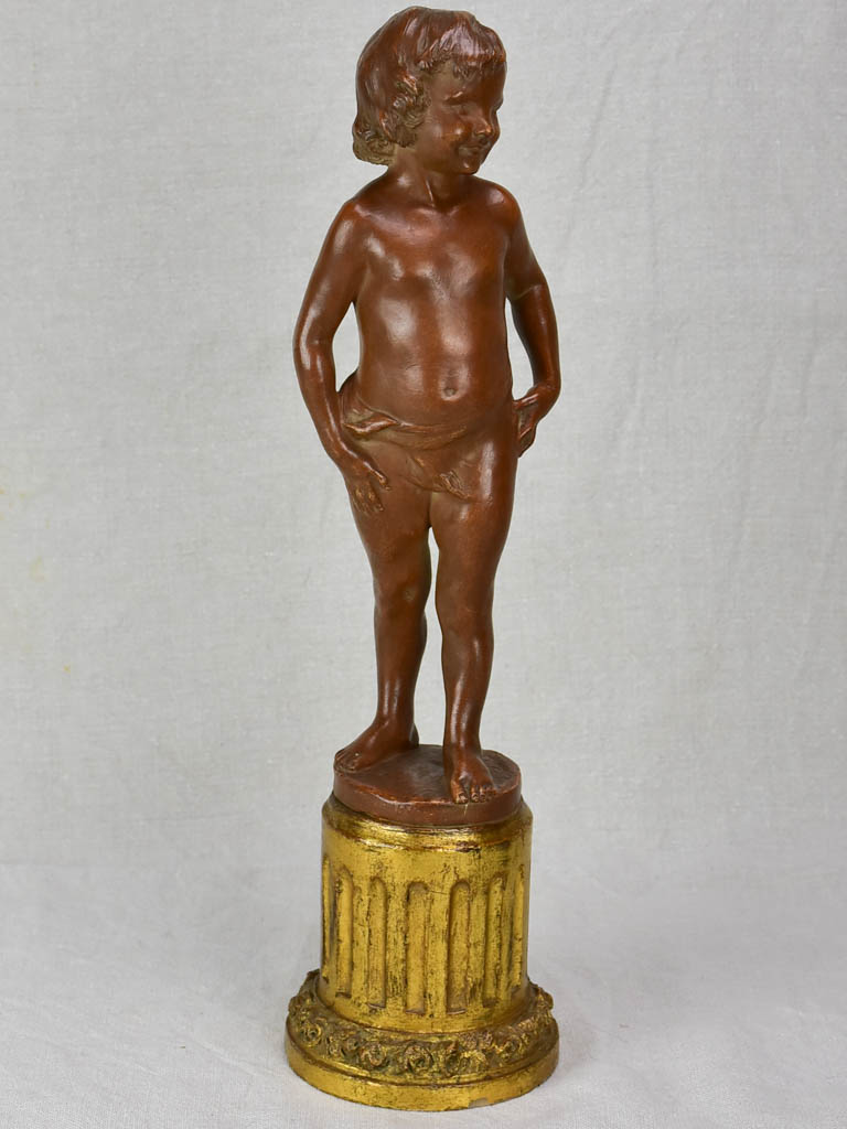Eary 20th Century French terracotta sculpture of a boy on a gilded column - signed