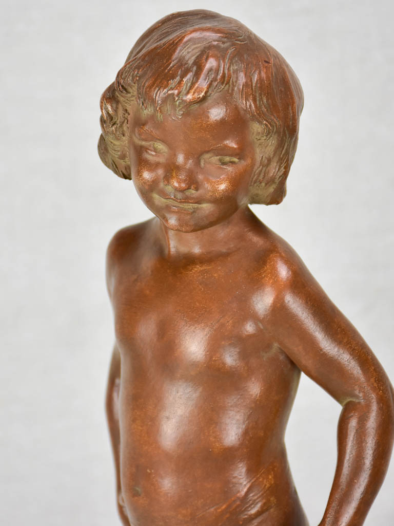 Eary 20th Century French terracotta sculpture of a boy on a gilded column - signed