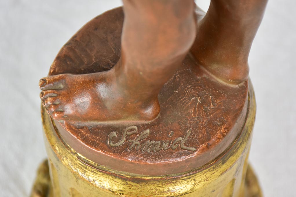 Eary 20th Century French terracotta sculpture of a boy on a gilded column - signed
