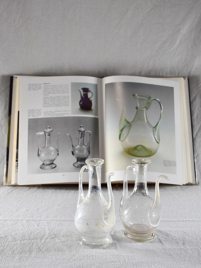 Two eighteenth-century blown glass oil pitchers