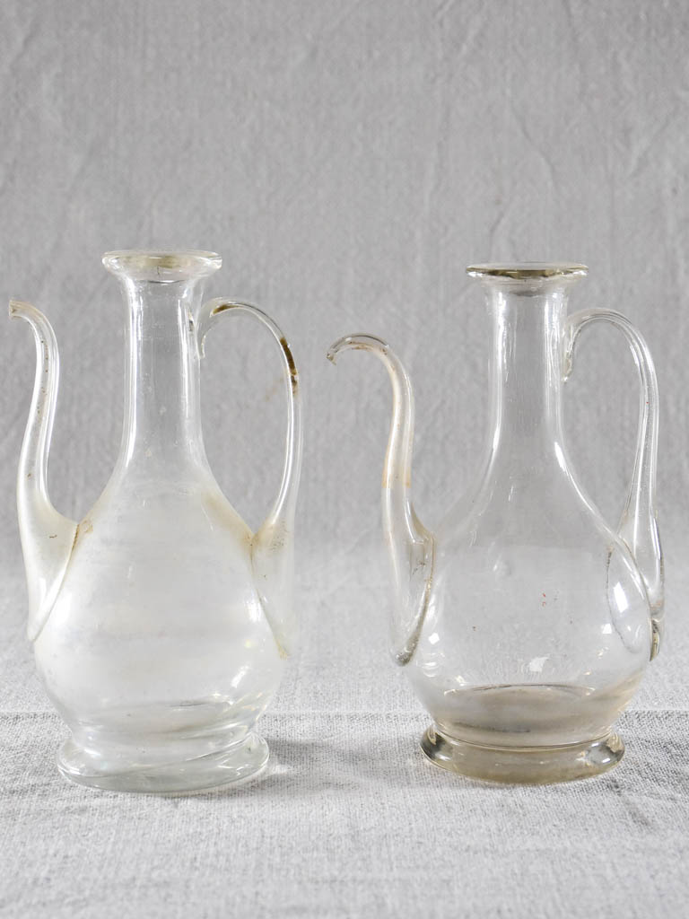 Two eighteenth-century blown glass oil pitchers