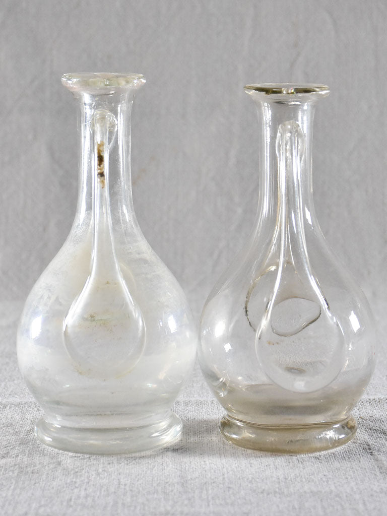Two eighteenth-century blown glass oil pitchers